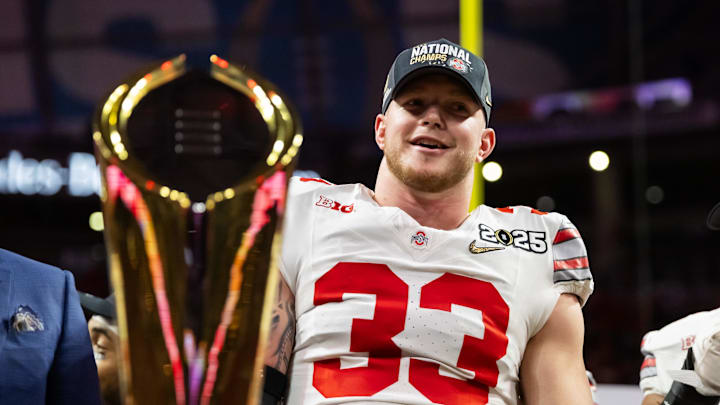 Jan 20, 2025; Atlanta, GA, USA; Ohio State Buckeyes defensive end Jack Sawyer (33) celebrates after defeating the Notre Dame Fighting Irish in the CFP National Championship college football game at Mercedes-Benz Stadium. Mandatory Credit: Mark J. Rebilas-Imagn Images
