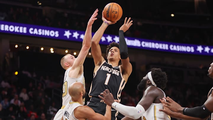 Jan 17, 2026; Atlanta, Georgia, USA; Atlanta Hawks forward Jalen Johnson (1) is defended by Boston Celtics forward Sam Hauser (30) in the first quarter at State Farm Arena. Mandatory Credit: Brett Davis-Imagn Images
