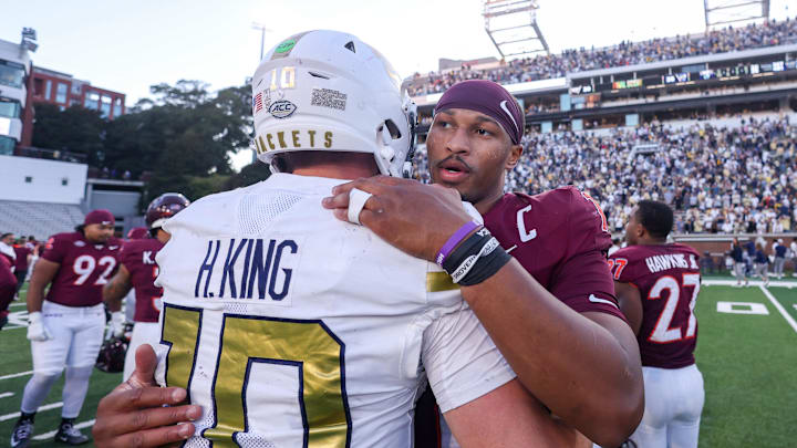 Oct 11, 2025; Atlanta, Georgia, USA; Georgia Tech Yellow Jackets quarterback Haynes King (10) talks to Virginia Tech Hokies quarterback Kyron Drones (1) after a game at Bobby Dodd Stadium at Hyundai Field. Mandatory Credit: Brett Davis-Imagn Images
