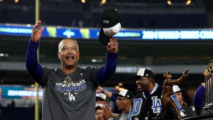 Oct 30, 2024; New York, New York, USA; Los Angeles Dodgers manager Dave Roberts (30) celebrates after winning the 2024 MLB World Series against the New York Yankees at Yankee Stadium. Mandatory Credit: Vincent Carchietta-Imagn Images