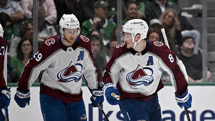Colorado Avalanche center Nathan MacKinnon (29) and defenseman Cale Makar (8)