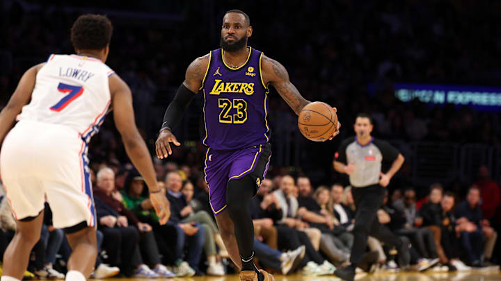 Mar 22, 2024; Los Angeles, California, USA; Los Angeles Lakers forward LeBron James (23) dribbles the ball against Philadelphia 76ers guard Kyle Lowry (7) during the fourth quarter at Crypto.com Arena. Mandatory Credit: Kiyoshi Mio-Imagn Images Mar 22, 2024; Los Angeles, California, USA; Los Angeles Lakers forward LeBron James (23) dribbles the ball against Philadelphia 76ers guard Kyle Lowry (7) during the fourth quarter at Crypto.com Arena. Mandatory Credit: Kiyoshi Mio-Imagn Images