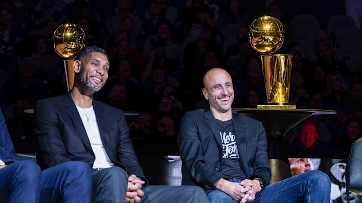Nov 11, 2019; San Antonio, TX, USA; Former San Antonio Spurs greats Tim Duncan and Manu Ginobili laugh during Tony Parker's retirement ceremony at the AT&T Center. Mandatory Credit: Daniel Dunn-Imagn Images