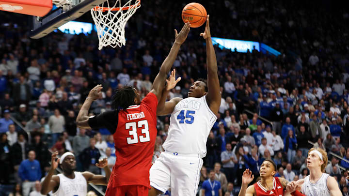 Fousseyni Traore takes a shot at the rim against the outstretched arms of the Texas Tech defense.