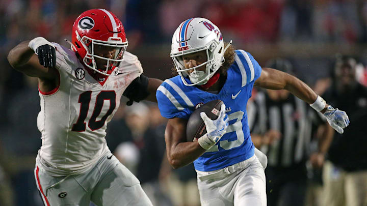 Nov 9, 2024; Oxford, Mississippi, USA; Mississippi Rebels wide receiver Cayden Lee (19) runs after a catch as Georgia Bulldogs linebacker Damon Wilson II (10) pursues during the second half at Vaught-Hemingway Stadium. Mandatory Credit: Petre Thomas-Imagn Images