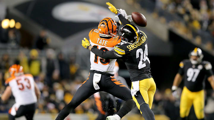 Cincinnati Bengals wide receiver Auden Tate (19) is unable to complete a catch as Pittsburgh Steelers cornerback Coty Sensabaugh (24) defends in the fourth quarter of a Week 17 NFL football game, Sunday, Dec. 30, 2018, at Heinz Field in Pittsburgh. The Cincinnati Bengals lead 10-3 at halftime. The Pittsburgh Steelers won 16-13. 

Cincinnati Bengals At Pittsburgh Steelers 12 30 2018