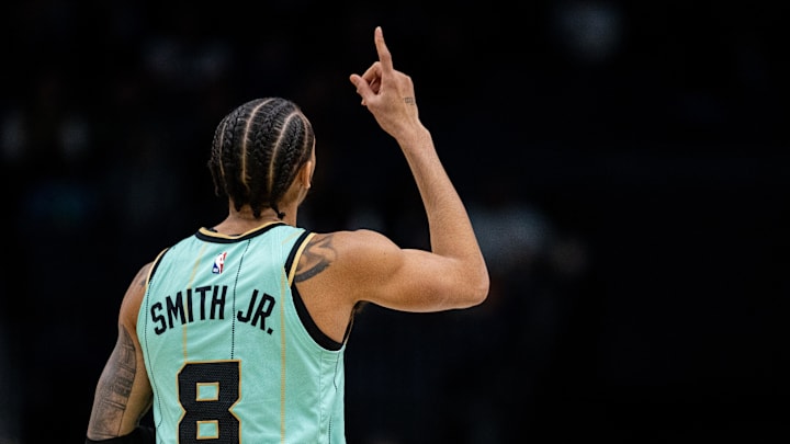 Jan 25, 2025; Charlotte, North Carolina, USA; Charlotte Hornets guard Nick Smith Jr. (8) celebrates during the fourth quarter against the New Orleans Pelicans at Spectrum Center. Mandatory Credit: Scott Kinser-Imagn Images
