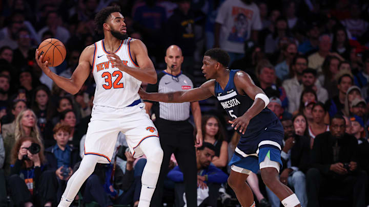 Oct 13, 2024; New York, New York, USA; New York Knicks center Karl-Anthony Towns (32) looks to pass as Minnesota Timberwolves guard Anthony Edwards (5) defends during the second half at Madison Square Garden. Oct 13, 2024; New York, New York, USA; New York Knicks center Karl-Anthony Towns (32) looks to pass as Minnesota Timberwolves guard Anthony Edwards (5) defends during the second half at Madison Square Garden.