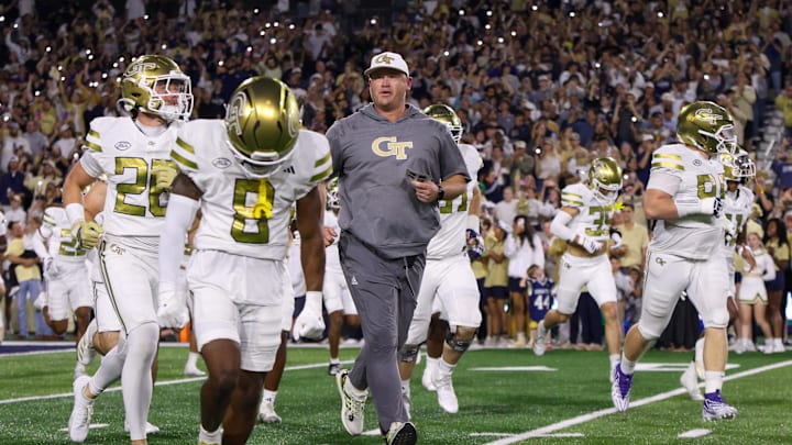Nov 22, 2025; Atlanta, Georgia, USA; Georgia Tech Yellow Jackets head coach Brent Key runs on the field before a game against the Pittsburgh Panthers at Bobby Dodd Stadium at Hyundai Field. Mandatory Credit: Brett Davis-Imagn Images
