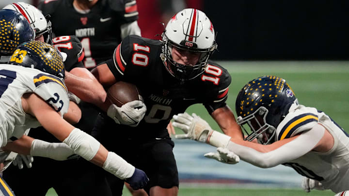 North Oconee's Doster (10) powers his way down the field during the GHSA Division 4A Football State Championship game in Atlanta, on Monday, Dec. 16, 2024.
