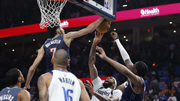 Dec 5, 2025; Oklahoma City, Oklahoma, USA; Oklahoma City Thunder center Chet Holmgren (7) blocks a shot by Dallas Mavericks forward Anthony Davis (3) during the second quarter at Paycom Center.