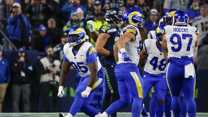 Nov 3, 2024; Seattle, Washington, USA; Los Angeles Rams defensive tackle Bobby Brown III (95) celebrates following a fourth down stop by the Rams against the Seattle Seahawks during overtime at Lumen Field. Mandatory Credit: Joe Nicholson-Imagn Images