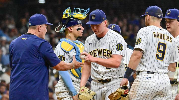 Sep 12, 2026; Milwaukee, Wisconsin, USA;  Milwaukee Brewers pitcher Kyle Harrison (52) hands the ball to manager Pat Murphy during a pitching change in the eighth inning against the Cincinnati Reds at American Family Field.  Mandatory Credit: Benny Sieu-Imagn Images