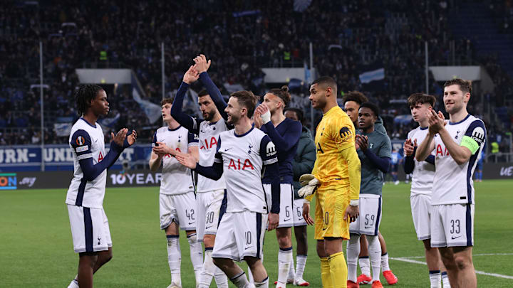 Spurs players acknowledge the away fans after the game 