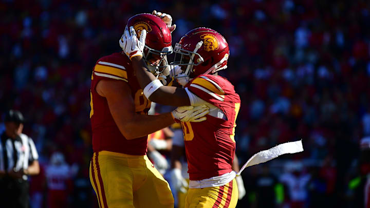 Trojans wide receiver Kyron Hudson (10) celebrates his touchdown scored against the Nebraska Cornhuskers with tight end Walker Lyons (85) during the first half at the Los Angeles Memorial Coliseum. Mandatory Credit: Gary A. Vasquez-Imagn Images