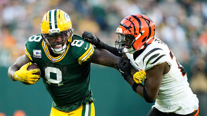 Oct 12, 2025; Green Bay, Wisconsin, USA; Green Bay Packers running back Josh Jacobs (8) runs the ball against Cincinnati Bengals safety Jordan Battle (27) in the second half at Lambeau Field. Mandatory Credit: Kayla Wolf-Imagn Images