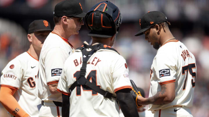Jul 14, 2024; San Francisco, California, USA; San Francisco Giants manager Bob Melvin (6) takes the ball from pitcher Camilo Doval (75) during the ninth inning against the Minnesota Twins at Oracle Park