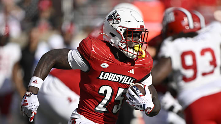 Sep 7, 2024; Louisville, Kentucky, USA;  Louisville Cardinals running back Isaac Brown (25) runs the ball against the Jacksonville State Gamecocks during the second half at L&N Federal Credit Union Stadium. Louisville defeated Jacksonville State 49-14. Mandatory Credit: Jamie Rhodes-Imagn Images