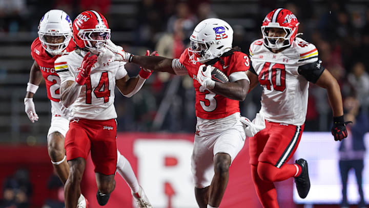 Nov 8, 2025; Piscataway, New Jersey, USA; Rutgers Scarlet Knights running back Antwan Raymond (3) fights off Maryland Terrapins defensive back Jamare Glasker (14) during the second half at SHI Stadium. Mandatory Credit: Vincent Carchietta-Imagn Images