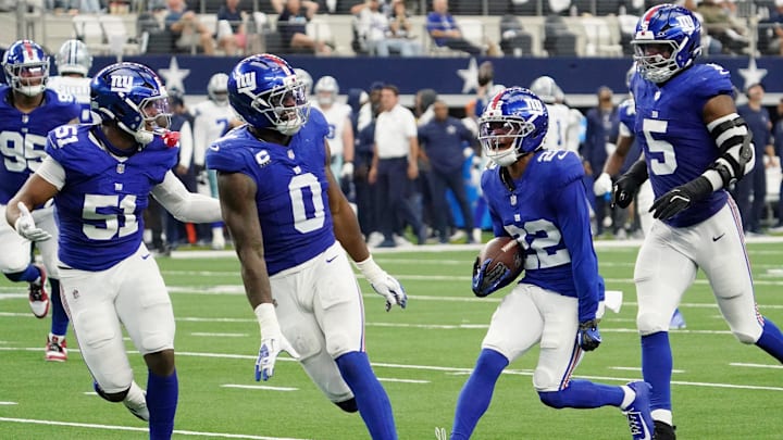 Sep 14, 2025; Arlington, Texas, USA; New York Giants cornerback Dru Phillips (22) celebrates after a play against the Dallas Cowboys during the third quarter at AT&T Stadium.  