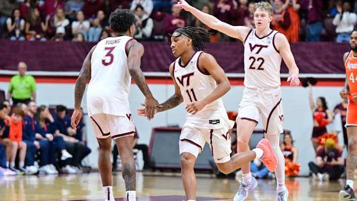 Mar 1, 2025; Blacksburg, Virginia, USA;  Virginia Tech Hokies guard Jaydon Young (3) congratulates Ben Hammond (11) after a three point basket during the first half against the Syracuse Orange at Cassell Coliseum. Mandatory Credit: Brian Bishop-Imagn Images