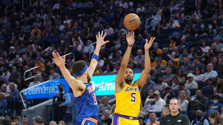 Apr 7, 2022; San Francisco, California, USA; Los Angeles Lakers guard Talen Horton-Tucker (5) shoots against Golden State Warriors guard Klay Thompson (11) during the second quarter at Chase Center. Mandatory Credit: Darren Yamashita-Imagn Images