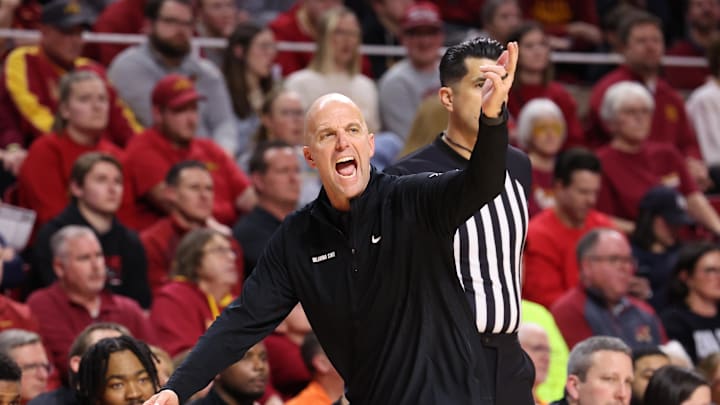 Jan 10, 2026; Ames, Iowa, USA; Oklahoma State Cowboys head coach Steve Lutz watches his team play the Iowa State Cyclones during the second half at James H. Hilton Coliseum. Mandatory Credit: Reese Strickland-Imagn Images Jan 10, 2026; Ames, Iowa, USA; Oklahoma State Cowboys head coach Steve Lutz watches his team play the Iowa State Cyclones during the second half at James H. Hilton Coliseum. Mandatory Credit: Reese Strickland-Imagn Images