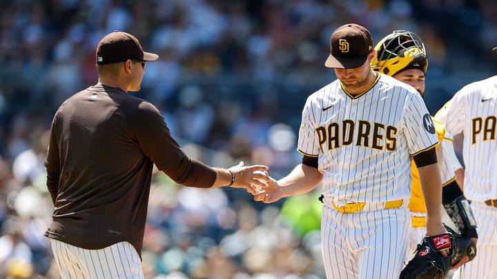 Jun 10, 2026; San Diego, California, USA; San Diego Padres manager Craig Stammen (14) takes the ball from starting pitcher Michael King (34) during the seventh inning against the Cincinnati Reds at Petco Park. Mandatory Credit: David Frerker-Imagn Images