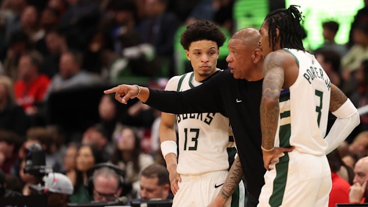 Feb 21, 2025; Washington, District of Columbia, USA; Milwaukee Bucks head coach Doc Rivers (M) talks to Milwaukee Bucks guard Ryan Rollins (13) and Bucks guard Kevin Porter Jr. (3) during a stoppage in play against the Washington Wizards in the second half at Capital One Arena. Mandatory Credit: Geoff Burke-Imagn Images