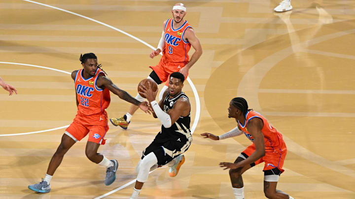 Dec 17, 2024; Las Vegas, Nevada, USA; Milwaukee Bucks forward Giannis Antetokounmpo (34) drives against Oklahoma City Thunder guard Cason Wallace (22), guard Alex Caruso (9) and forward Jalen Williams (8) during the 2nd quarter of the Emirates NBA Cup championship game at T-Mobile Arena. Mandatory Credit: Candice Ward-Imagn Images Dec 17, 2024; Las Vegas, Nevada, USA; Milwaukee Bucks forward Giannis Antetokounmpo (34) drives against Oklahoma City Thunder guard Cason Wallace (22), guard Alex Caruso (9) and forward Jalen Williams (8) during the 2nd quarter of the Emirates NBA Cup championship game at T-Mobile Arena. Mandatory Credit: Candice Ward-Imagn Images