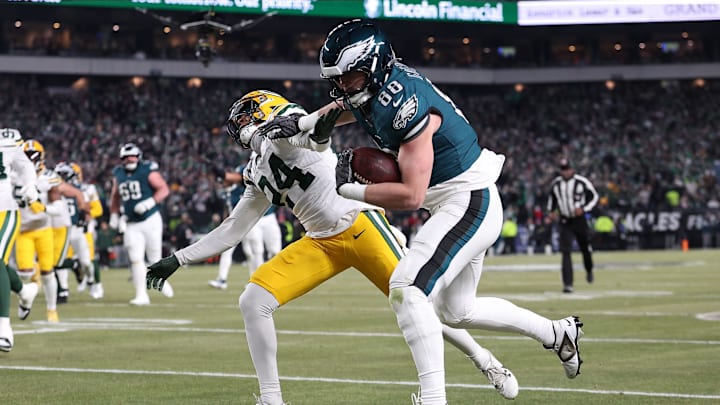Philadelphia Eagles tight end Dallas Goedert (88) runs over Green Bay Packers cornerback Carrington Valentine for a touchdown.