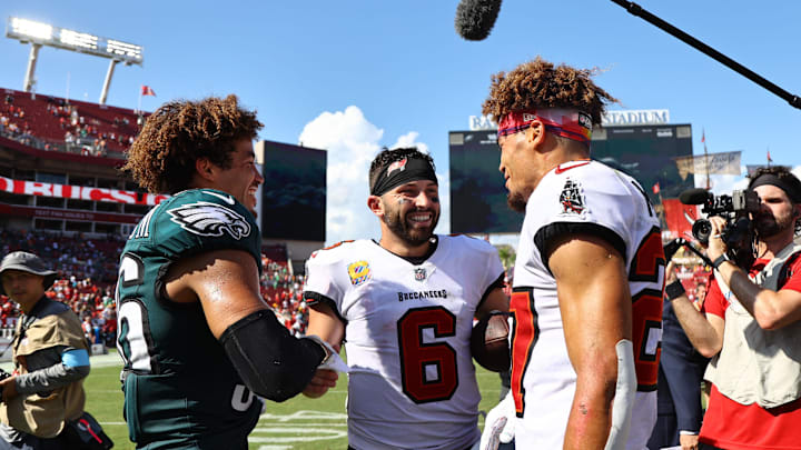 Sep 29, 2024; Tampa, Florida, USA; Twins, Philadelphia Eagles safety Tristin McCollum (36) and Tampa Bay Buccaneers cornerback Zyon McCollum (27) talk with Tampa Bay Buccaneers quarterback Baker Mayfield (6) after the game at Raymond James Stadium. Mandatory Credit: Kim Klement Neitzel-Imagn Images