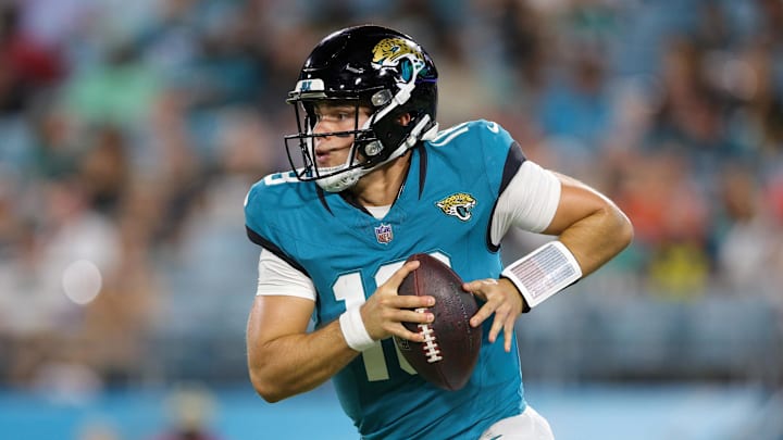 Aug 26, 2023; Jacksonville, Florida, USA;  Jacksonville Jaguars quarterback Nathan Rourke (18) drops