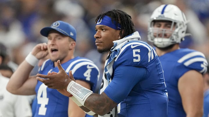 Sep 29, 2024; Indianapolis, Indiana, USA;  Indianapolis Colts quarterback Anthony Richardson (5) watches the action on the field from the sideline Sunday, Sept. 29, 2024, during a game against the Pittsburgh Steelers at Lucas Oil Stadium in Indianapolis. Mandatory Credit: Christine Tannous-USA TODAY Network via Imagn Images