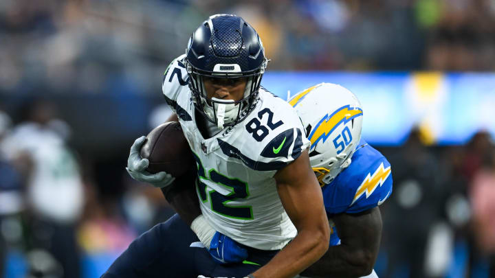 Aug 10, 2024; Inglewood, California, USA; Seattle Seahawks wide receiver Cody White (82) runs the ball against Los Angeles Chargers linebacker Shane Lee (50) during the fourth quarter at SoFi Stadium. Mandatory Credit: Jonathan Hui-USA TODAY Sports