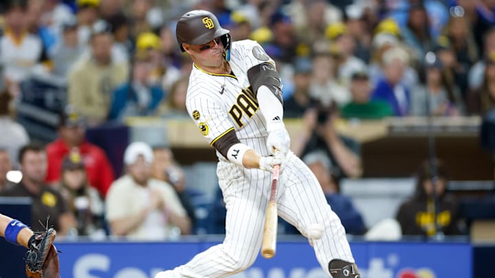 Apr 28, 2026; San Diego, California, USA; San Diego Padres first baseman Ty France (25) hits a RBI single during the fourth inning against the Chicago Cubs at Petco Park. Mandatory Credit: David Frerker-Imagn Images