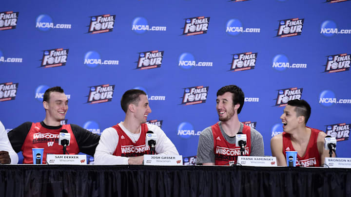 Apr 5, 2015; Indianapolis, IN, USA; Wisconsin Badgers forward Sam Dekker (15) and guard Josh Gasser (21) and forward Frank Kaminsky (44) and guard Bronson Koenig (24) react during the Wisconsin press conference at Lucas Oil Stadium.