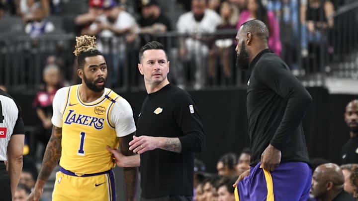 Los Angeles Lakers guard D'Angelo Russell (1), head coach JJ Redick and forward LeBron James (23) talk against the Golden State Warriors in the first quarter during a preseason game at T-Mobile Arena. Mandatory Credit: Candice Ward-Imagn Images Los Angeles Lakers guard D'Angelo Russell (1), head coach JJ Redick and forward LeBron James (23) talk against the Golden State Warriors in the first quarter during a preseason game at T-Mobile Arena. Mandatory Credit: Candice Ward-Imagn Images