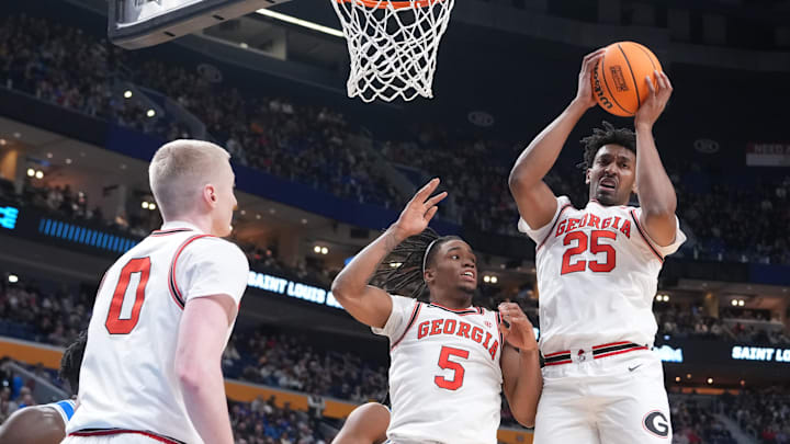 Mar 19, 2026; Buffalo, NY, USA; Georgia Bulldogs forward Justin Abson (25) rebounds the ball with guards Jeremiah Wilkinson (5) and Blue Blue Cain (0) against the Saint Louis Billikens during the first half of a first round game of the men's 2026 NCAA Tournament at Keybank Center. Mandatory Credit: Gregory Fisher-Imagn Images