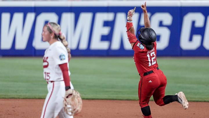 Texas Tech catcher Jasmyn Burns hits a home run. Texas Tech catcher Jasmyn Burns hits a home run.