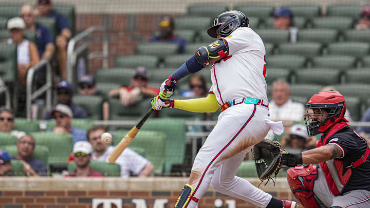 Sep 24, 2025; Cumberland, Georgia, USA; Atlanta Braves designated hitter Marcell Ozuna (20) hits a home run against the Washington Nationals during the eighth inning at Truist Park. Mandatory Credit: Dale Zanine-Imagn Images