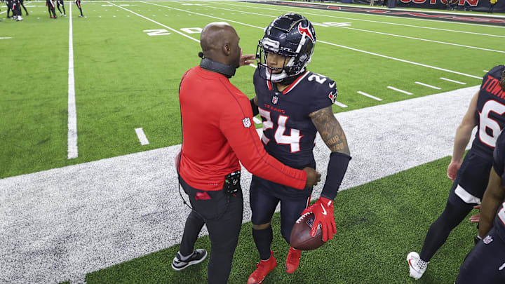 Jan 11, 2025; Houston, Texas, USA; Houston Texans head coach DeMeco Ryans embraces cornerback Derek Stingley Jr. (24) after a Stingley interception during the game against the Los Angeles Chargers in an AFC wild card game at NRG Stadium. Mandatory Credit: Troy Taormina-Imagn Images