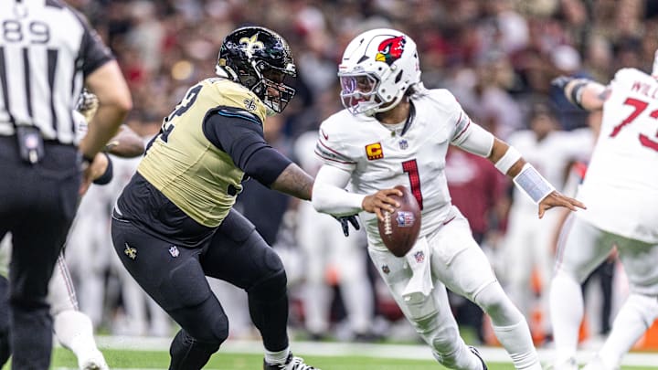 Sep 7, 2025; New Orleans, Louisiana, USA; New Orleans Saints defensive tackle Davon Godchaux (92) chases Arizona Cardinals quarterback Kyler Murray (1) out the pocket during the second half at Caesars Superdome. Mandatory Credit: Stephen Lew-Imagn Images