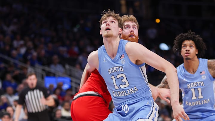 Dec 20, 2025; Atlanta, Georgia, USA; North Carolina Tar Heels center Henri Veesaar (13) boxes out Ohio State Buckeyes forward Brandon Noel (14) in the first half at State Farm Arena. Mandatory Credit: Brett Davis-Imagn Images Dec 20, 2025; Atlanta, Georgia, USA; North Carolina Tar Heels center Henri Veesaar (13) boxes out Ohio State Buckeyes forward Brandon Noel (14) in the first half at State Farm Arena. Mandatory Credit: Brett Davis-Imagn Images