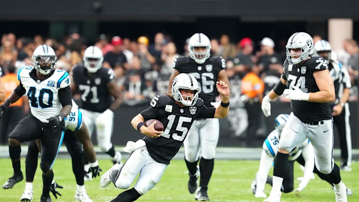 Sep 22, 2024; Paradise, Nevada, USA; Las Vegas Raiders quarterback Gardner Minshew (15) is flushed from the pocket by the Carolina Panthers during the third quarter at Allegiant Stadium. Mandatory Credit: Stephen R. Sylvanie-Imagn Images