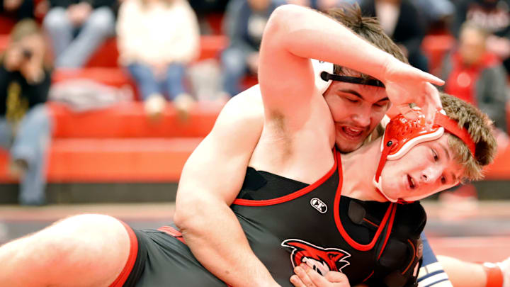 Kiski Area's Cooper Roscosky works to secure position during a section match against Fox Chapel's Joe Geller in January. Roscosky, who will wrestler at the University of Buffalo, will compete at 215 pounds for the WPIAL team.