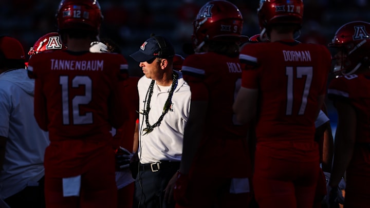 Nov 30, 2024; Tucson, Arizona, USA; Arizona Wildcats head coach Brent Brennan talks with team during the fourth quarter against the Arizona State Sun Devils at Arizona Stadium. Mandatory Credit: Aryanna Frank-Imagn Images