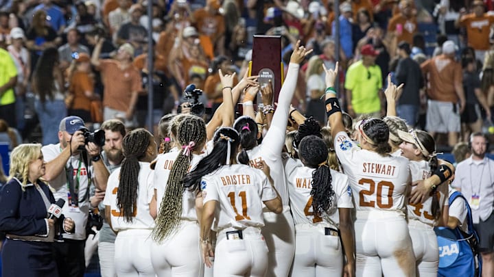 Jun 6, 2025; Oklahoma City, OK, USA; Texas Longhorns players hold up the trophy after beating the Texas Tech Red Raiders 10-4 to win the National Championship in game three of the NCAA Softball Women's College World Series finals at Devon Park. Mandatory Credit: Brett Rojo-Imagn Images Jun 6, 2025; Oklahoma City, OK, USA; Texas Longhorns players hold up the trophy after beating the Texas Tech Red Raiders 10-4 to win the National Championship in game three of the NCAA Softball Women's College World Series finals at Devon Park. Mandatory Credit: Brett Rojo-Imagn Images