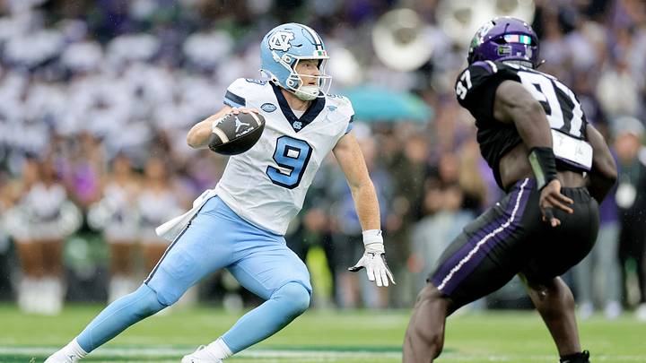 Aug 29, 2026; Dublin, Co. Dublin, IRL;  North Carolina Tar Heels quarterback Billy Edwards Jr. (9) runs the ball against TCU Horned Frogs linebacker Paul Oyewale (97) in the first half at Aviva Stadium.  Mandatory Credit: Laszlo Geczo-Imagn Images