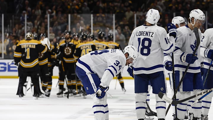 Oct 26, 2024; Boston, Massachusetts, USA; Toronto Maple Leafs center Auston Matthews (34) and teammates head for the dressing room as the Boston Bruins congratulate each other after their 4-3 overtime win at TD Garden. Mandatory Credit: Winslow Townson-Imagn Images